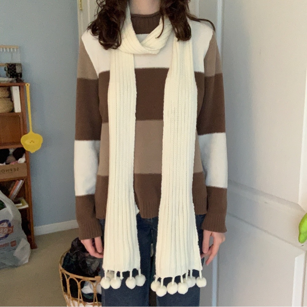 cream scarf with pom poms